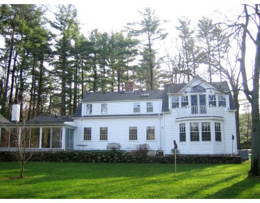 22 Normandie Road Dover, MA 02030 - Photo 2 of 11 a front view of a house with a yard