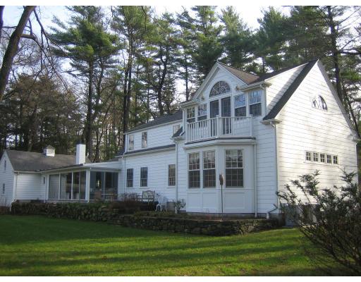 22 Normandie Road Dover, MA 02030 - Photo 3 of 11 a front view of a house with a yard