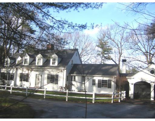 22 Normandie Road Dover, MA 02030 - Photo 10 of 11 front view of a brick house with a yard