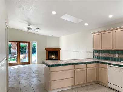 a kitchen with a sink cabinets and window