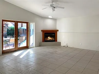 a view of an empty room with a fireplace