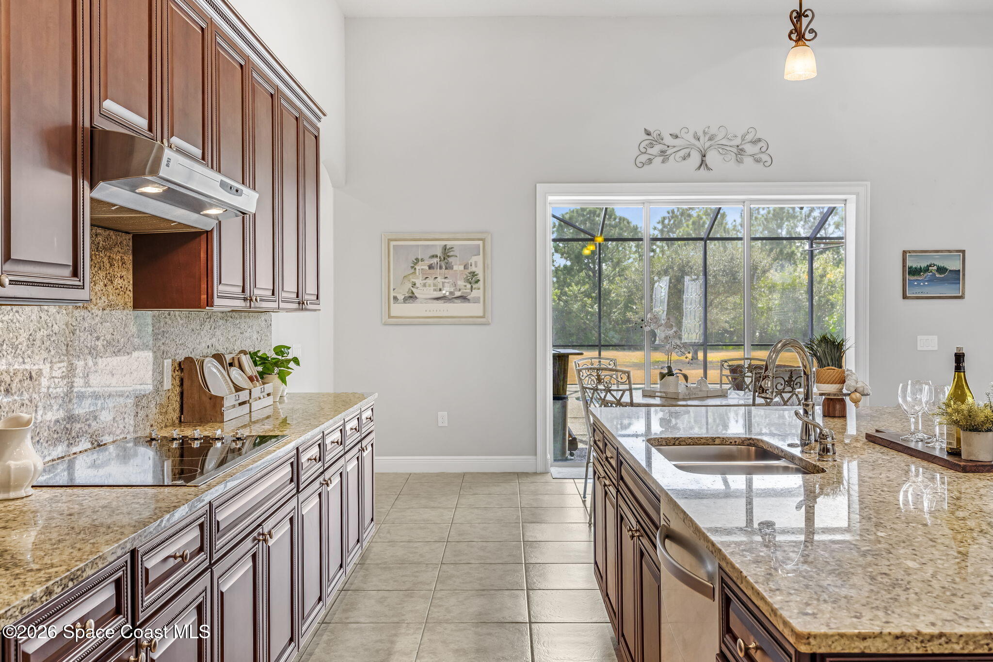 4567 Preservation Circle Melbourne, FL 32934 - Photo 21 of 75 View from the kitchen to the backyard