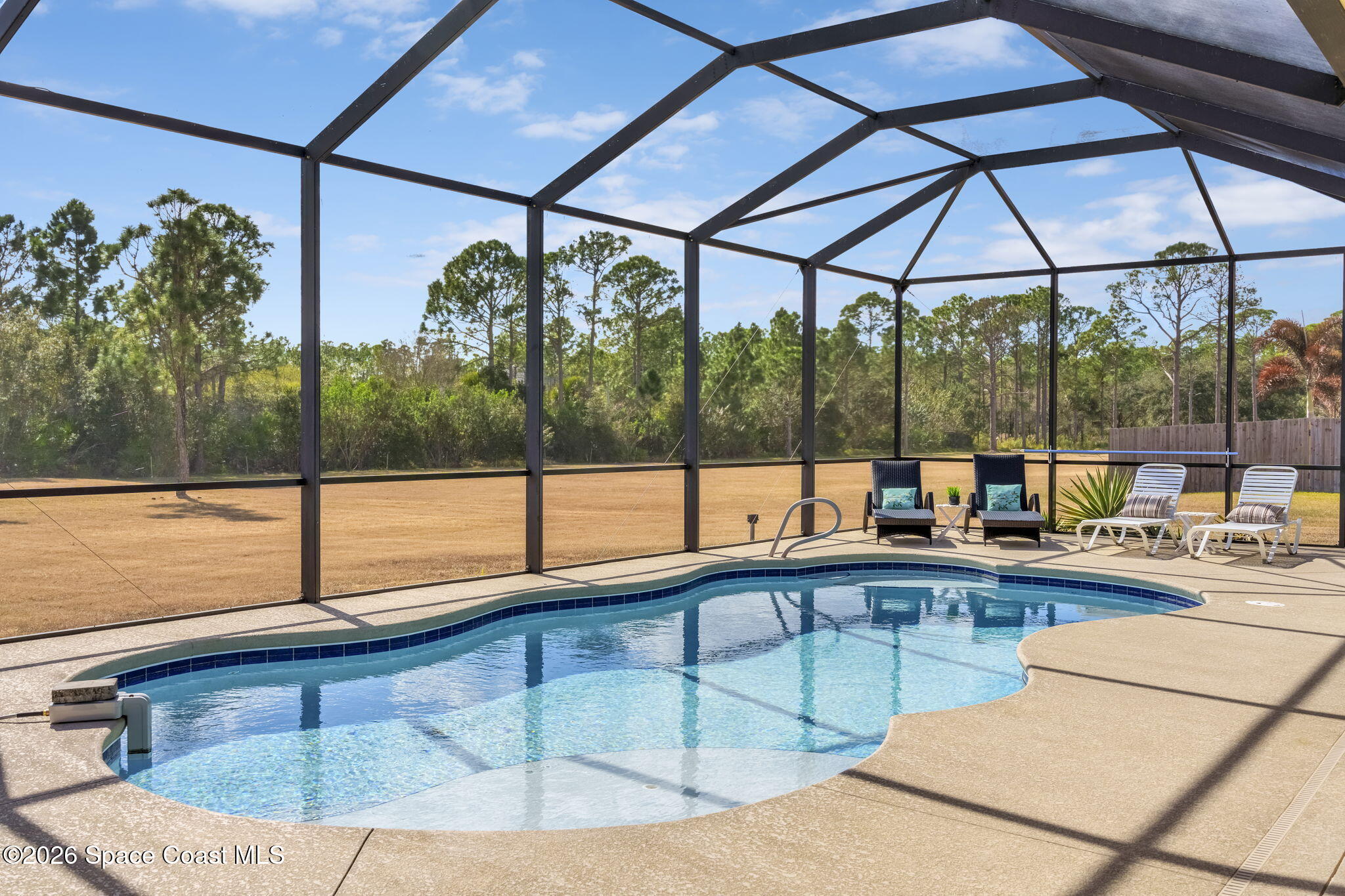 4567 Preservation Circle Melbourne, FL 32934 - Photo 57 of 75 View from the Pool to a HUGE Backyard