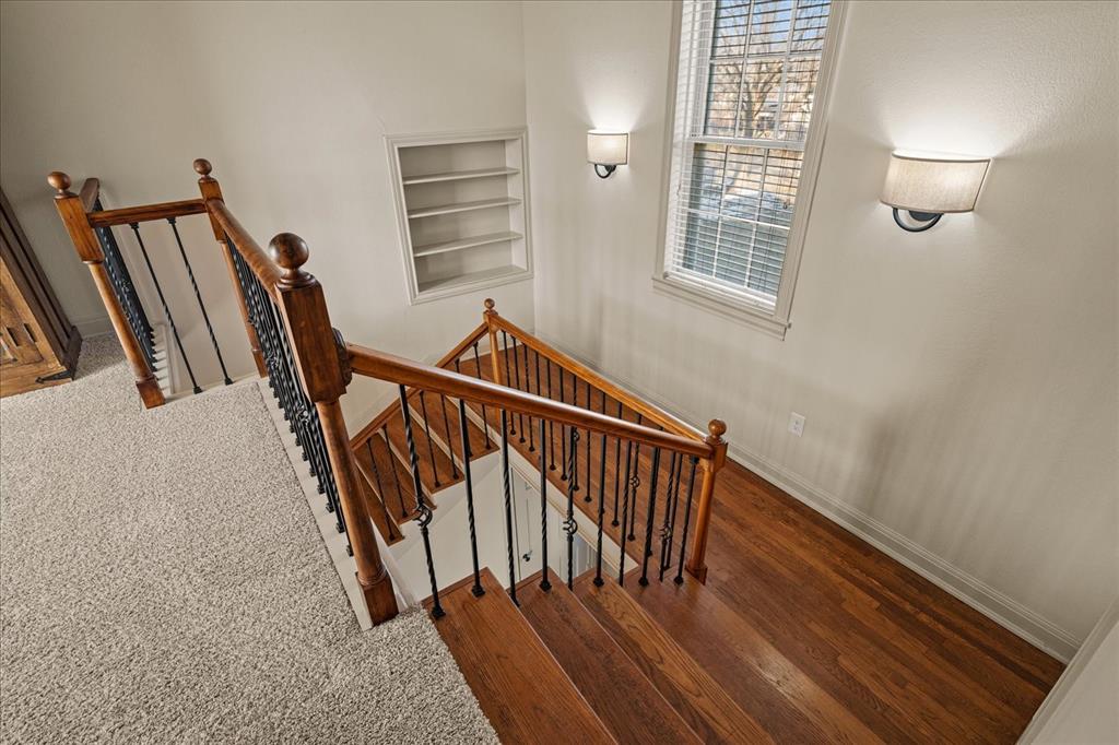 601 North Main Street Leonard, TX 75452 - Photo 14 of 34 Stairway featuring built in shelves and wood finished floors