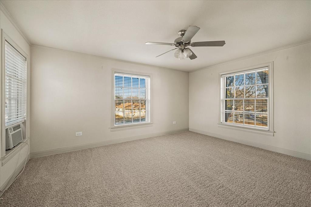 601 North Main Street Leonard, TX 75452 - Photo 21 of 34 Carpeted spare room featuring a ceiling fan, cooling unit, and ornamental molding