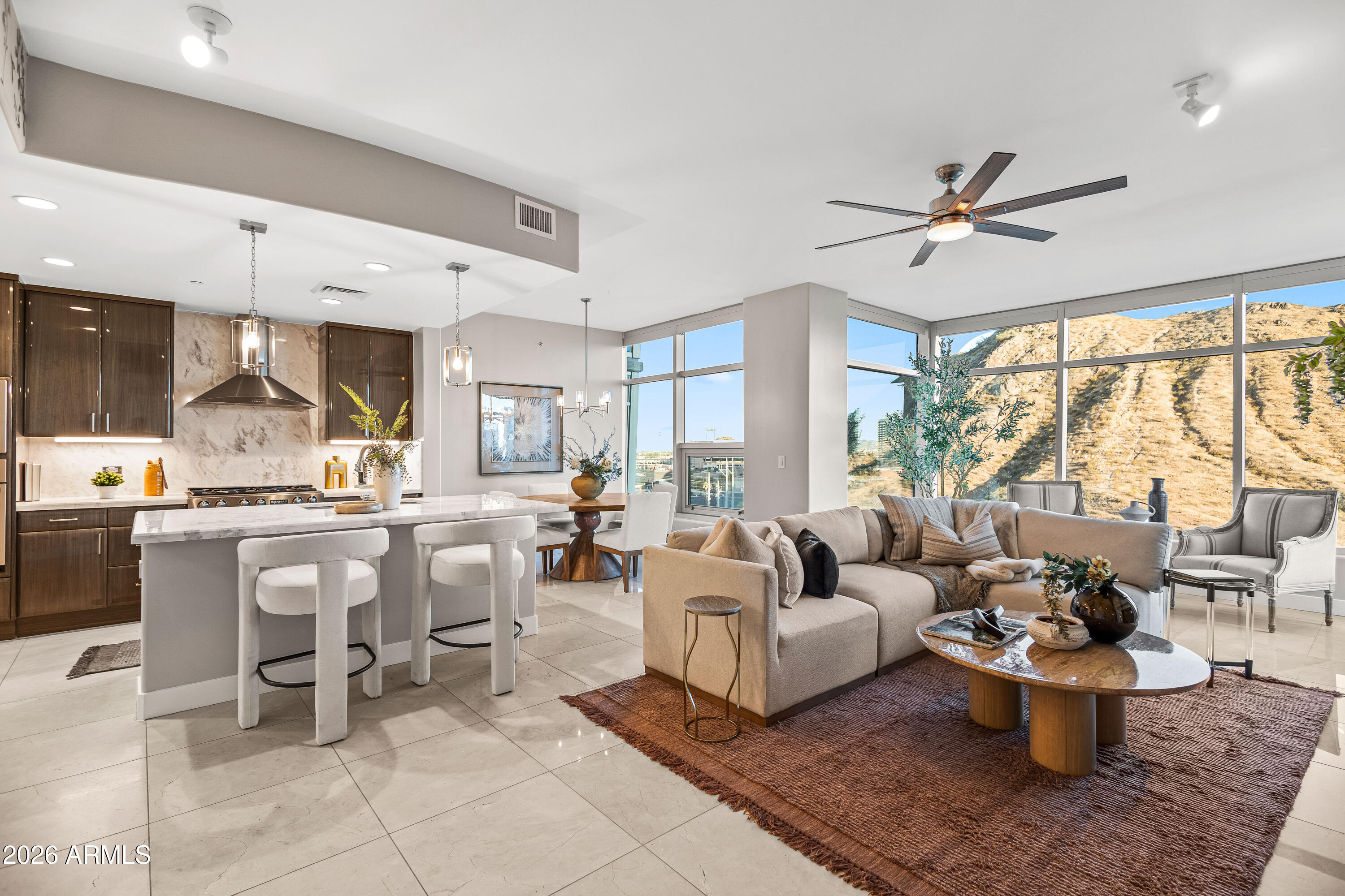 140 East Rio Salado Parkway, Unit 1101 Tempe, AZ 85281 - Photo 1 of 32 a living room with furniture a rug and a large window