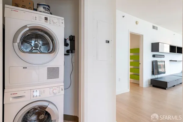 a view of a hallway with washer and dryer