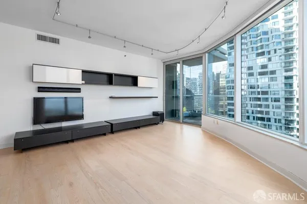 a view of an empty room with a window