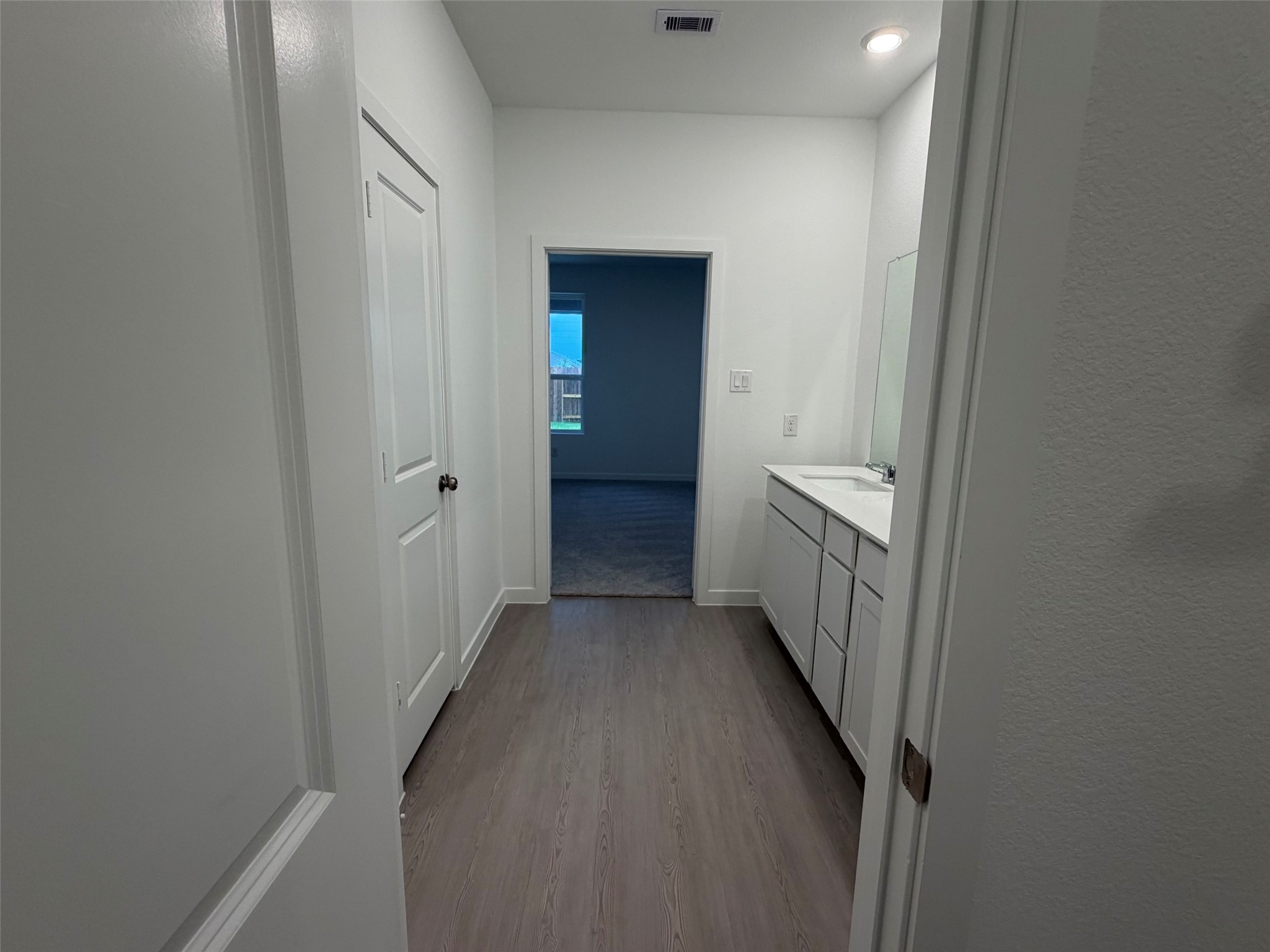 2514 Rose Gold Drive Rosharon, TX 77583 - Photo 14 of 27 a view of a hallway with wooden floor and a bathroom