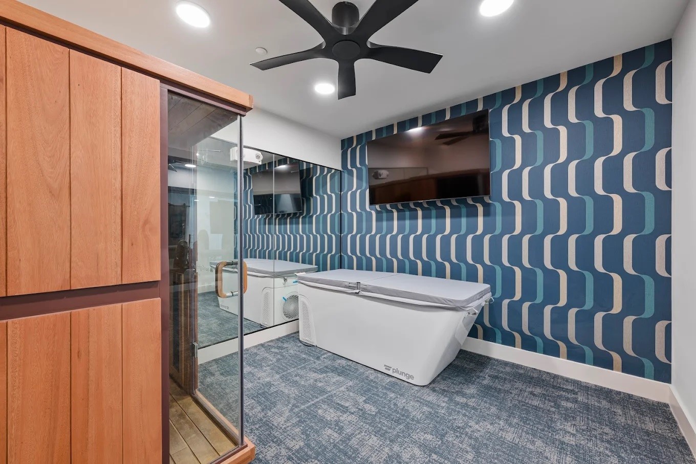 1888 Brittmoore Road, Unit 1236 Houston, TX 77043 - Photo 6 of 16 a living room with a couch and a ceiling fan