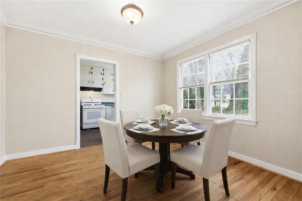 1911 North Decatur Road, Unit 2 Atlanta, GA 30307 - Photo 6 of 16 a view of a dining room with furniture and wooden floor