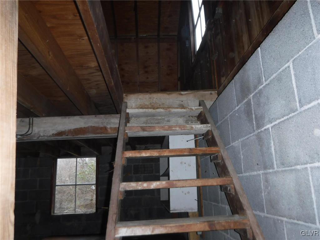 755 Silver Spring Boulevard Kunkletown, PA 18058 - Photo 13 of 20 a view of staircase with white walls and windows