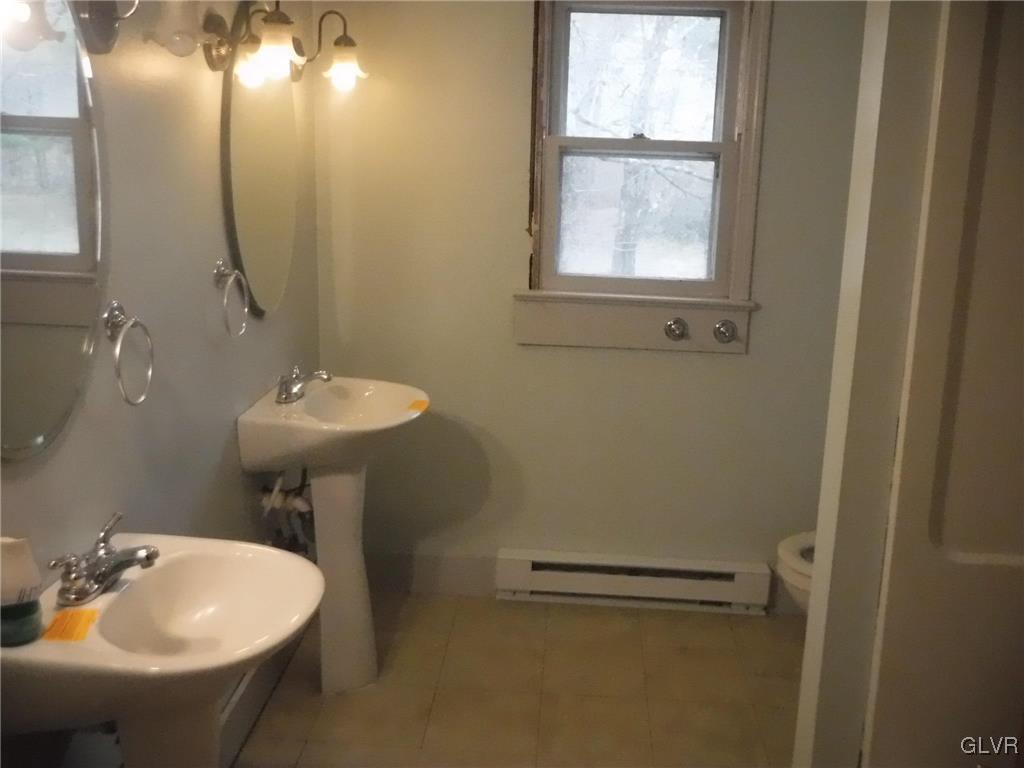 755 Silver Spring Boulevard Kunkletown, PA 18058 - Photo 17 of 20 a bathroom with a sink toilet and a mirror