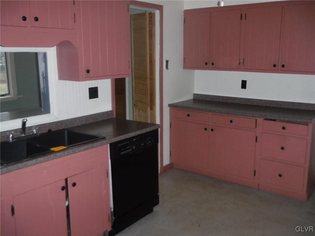 755 Silver Spring Boulevard Kunkletown, PA 18058 - Photo 7 of 20 a kitchen with granite countertop cabinets and white appliances