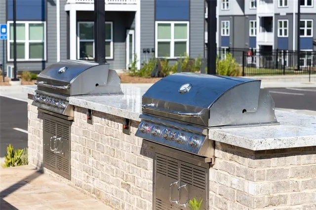 a living room with furniture a flat screen tv and gym equipment