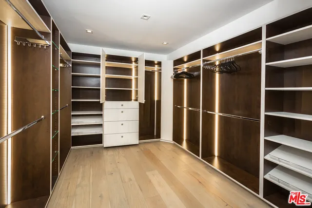 a bed room with a bed and furniture