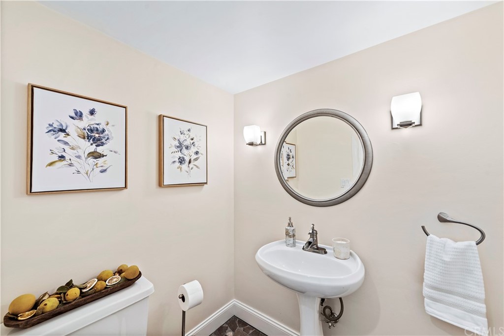 35232 Camino Capistrano, Unit 6 Dana Point, CA 92624 - Photo 12 of 25 a bathroom with a sink mirror and toilet