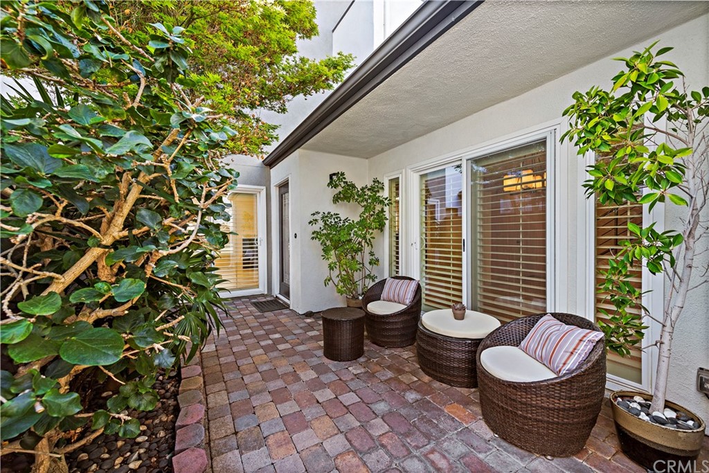 35232 Camino Capistrano, Unit 6 Dana Point, CA 92624 - Photo 4 of 25 a view of a patio with chairs and plants