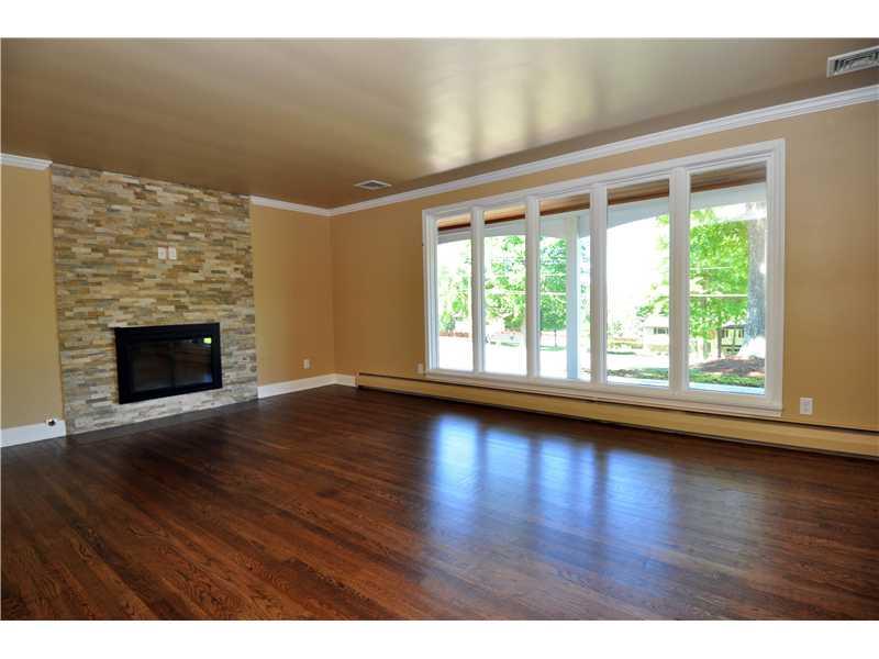 675 Bairdford Road Tarentum, PA 15084 - Photo 3 of 22 Living Room. Living room is crisp with novel fireplace faade....Natural light is evident....