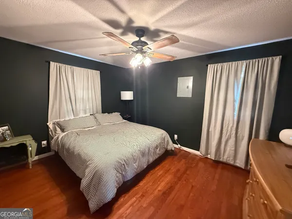a bedroom with furniture and a window