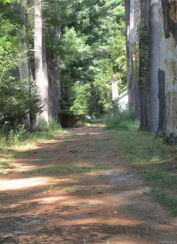 a view of a house with backyard porch and sitting area