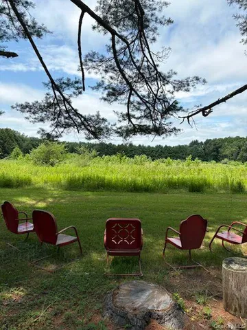 a view of a yard with an outdoor space