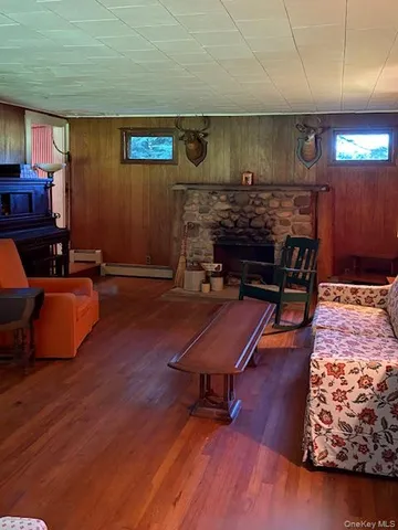 a bedroom with furniture and wooden floor