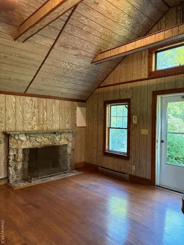 a view of a dining room with furniture and window