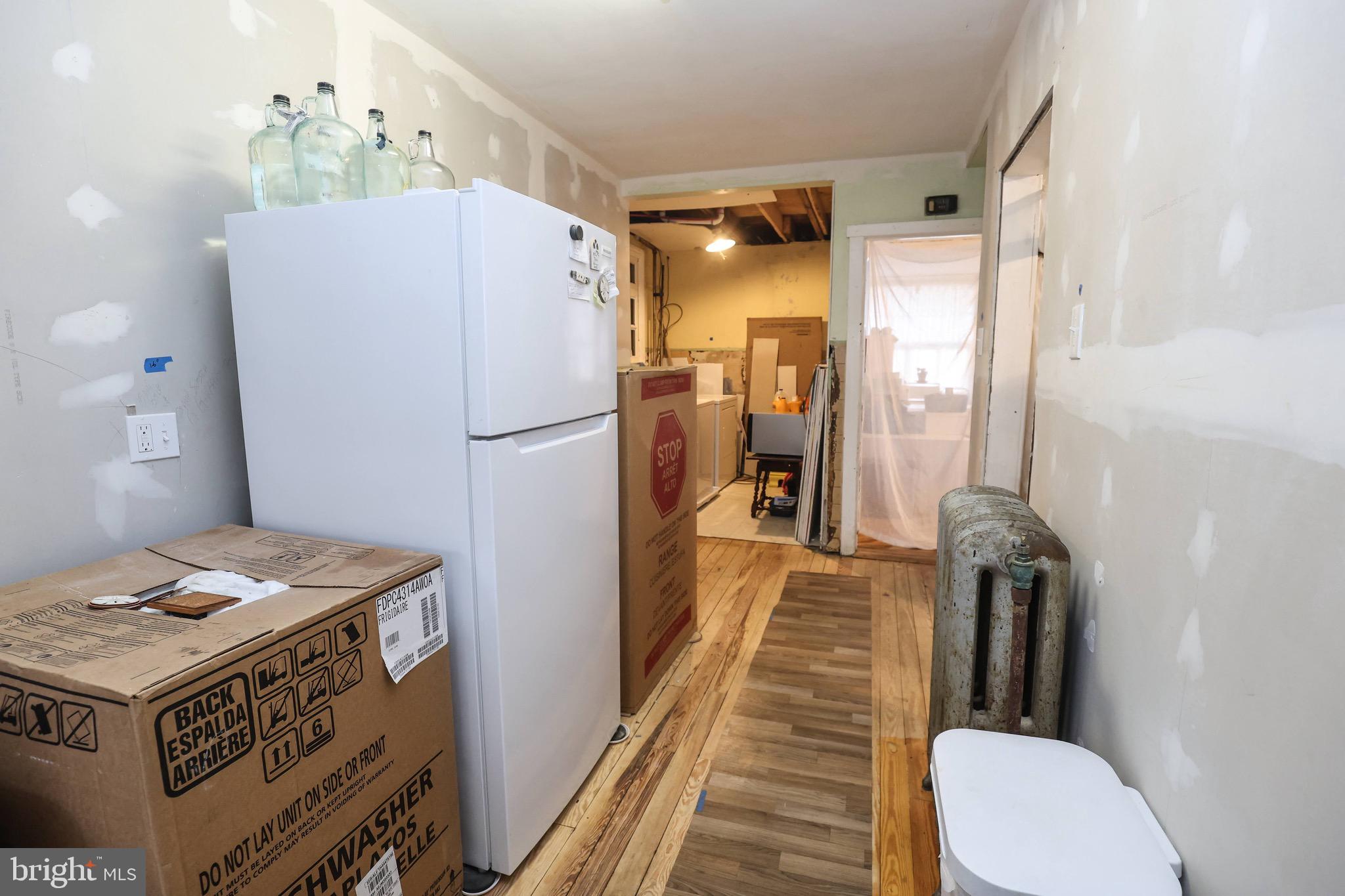 535 Main Street Lykens, PA 17048 - Photo 12 of 47 a kitchen with a refrigerator a stove and wooden floor