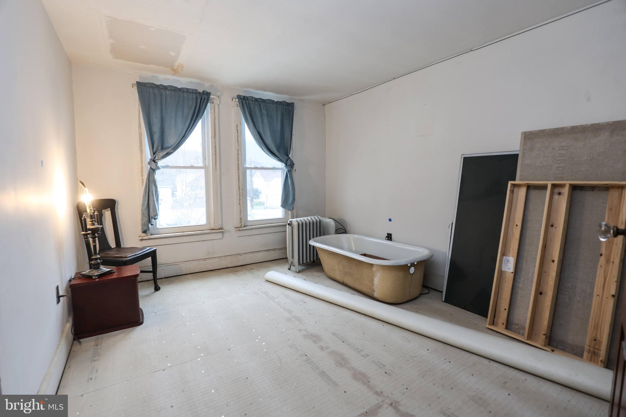 535 Main Street Lykens, PA 17048 - Photo 15 of 47 a living room with furniture and a window