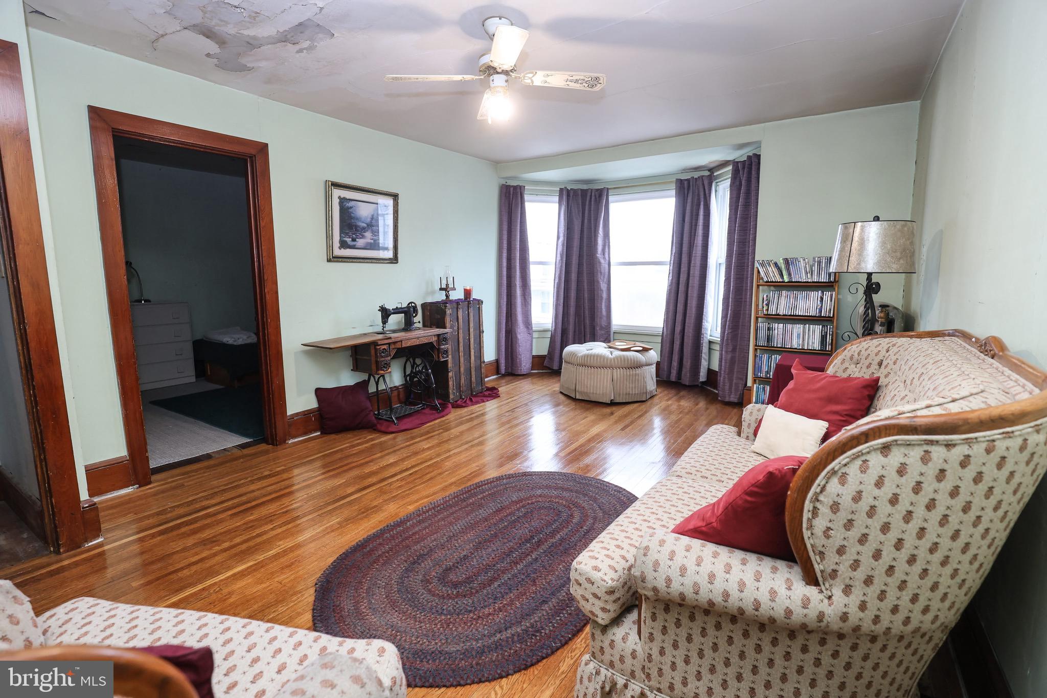 535 Main Street Lykens, PA 17048 - Photo 31 of 47 a bedroom with furniture and a wooden floor