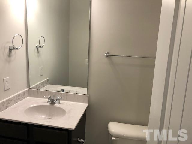 252 Spark Street Raleigh, NC 27606 - Photo 12 of 12 a bathroom with a sink and a toilet