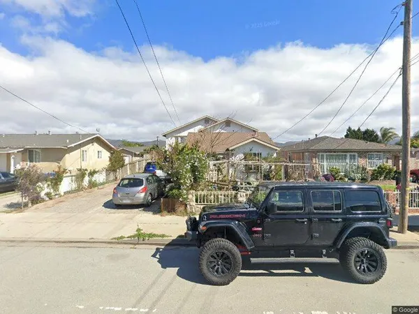 a view of a car in front of house
