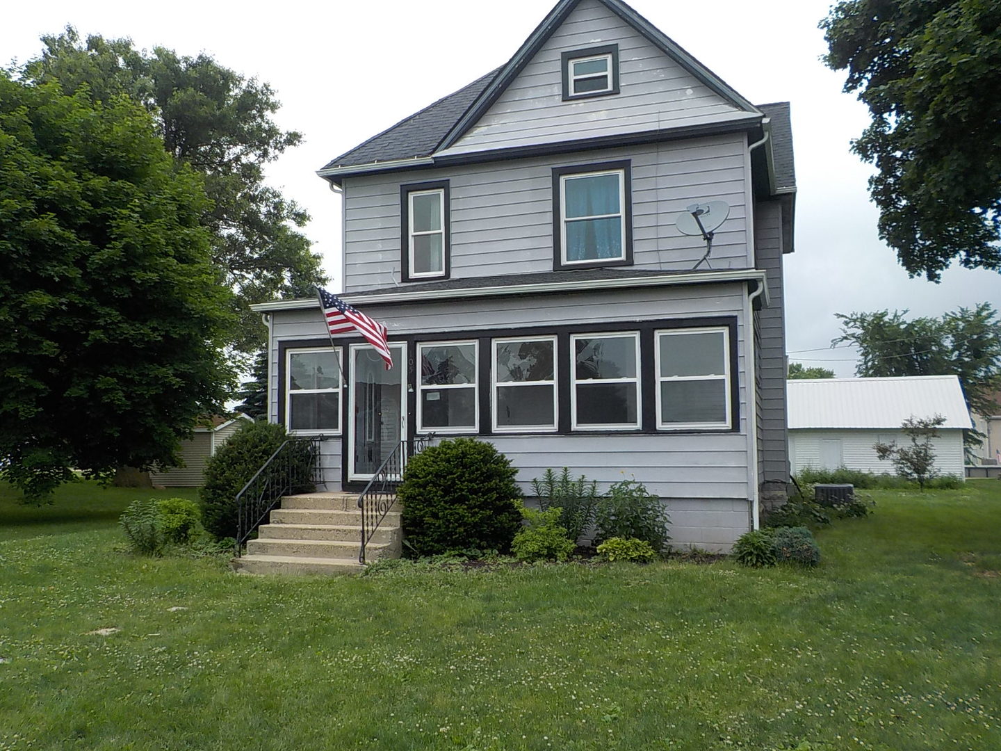 105 Main Street Kings, IL 61068 - Photo 18 of 19 a front view of a house with a yard