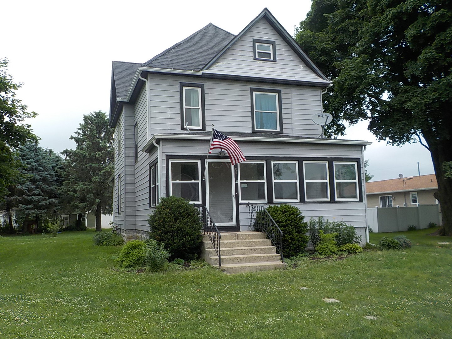 105 Main Street Kings, IL 61068 - Photo 19 of 19 a front view of a house with a yard