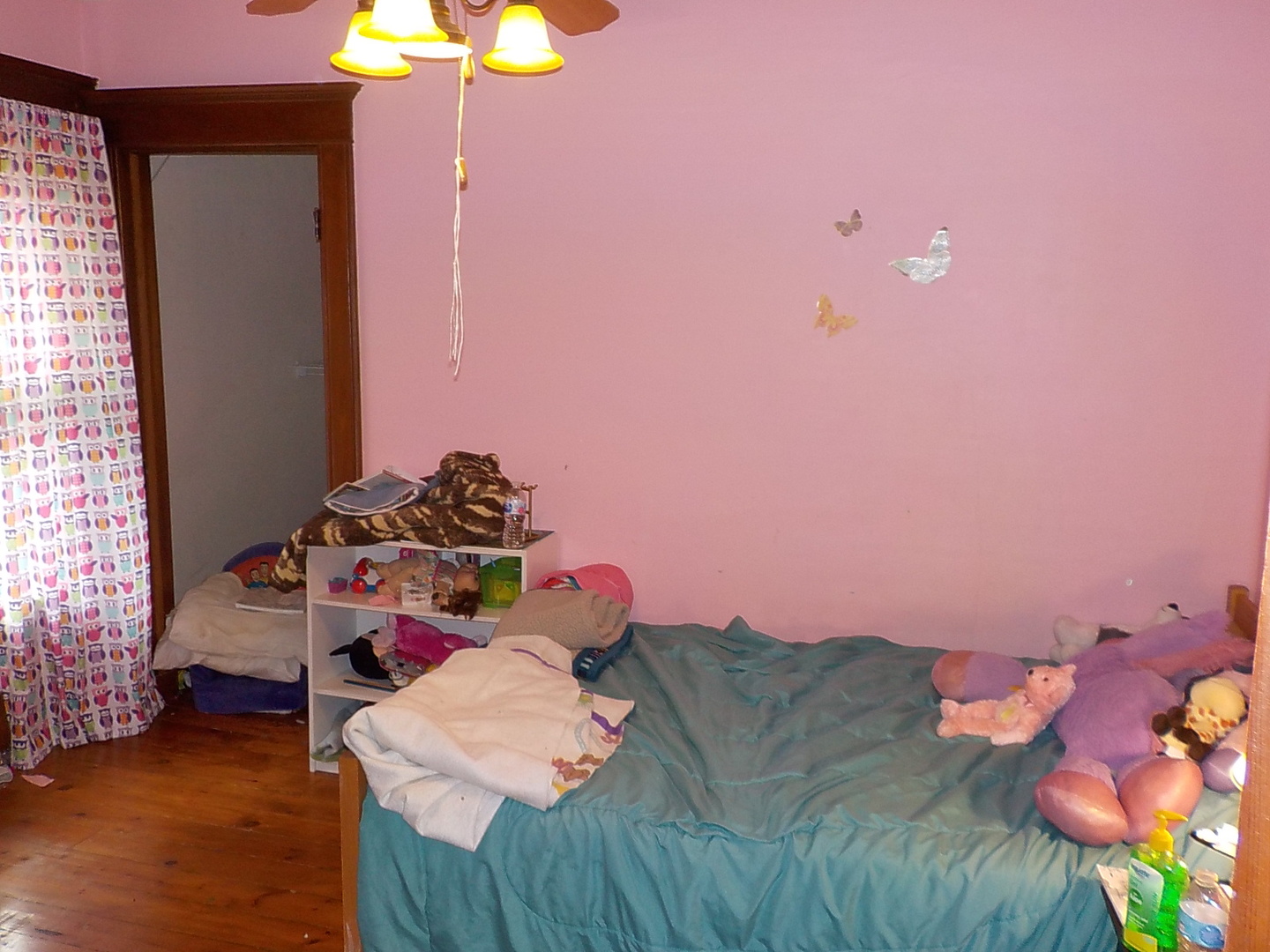 105 Main Street Kings, IL 61068 - Photo 9 of 19 a bedroom with a bed and a chandelier