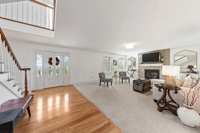 a kitchen with kitchen island granite countertop a sink stove and refrigerator