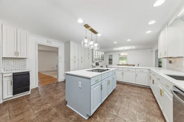 a view of a hallway with wooden floor and entryway