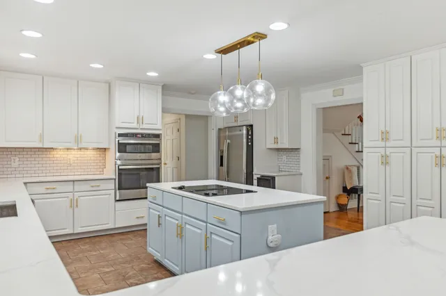 a living room with furniture and a pool table