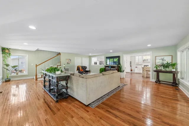 a balcony with furniture and wooden floor