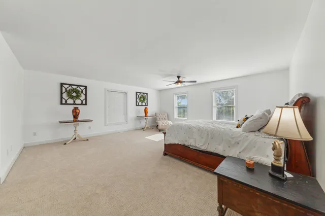 an aerial view of a house with outdoor space pool seating area and yard