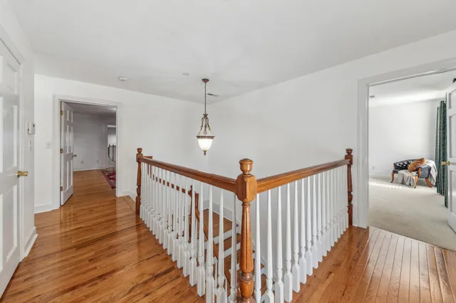 a view of a garden with a building in the background