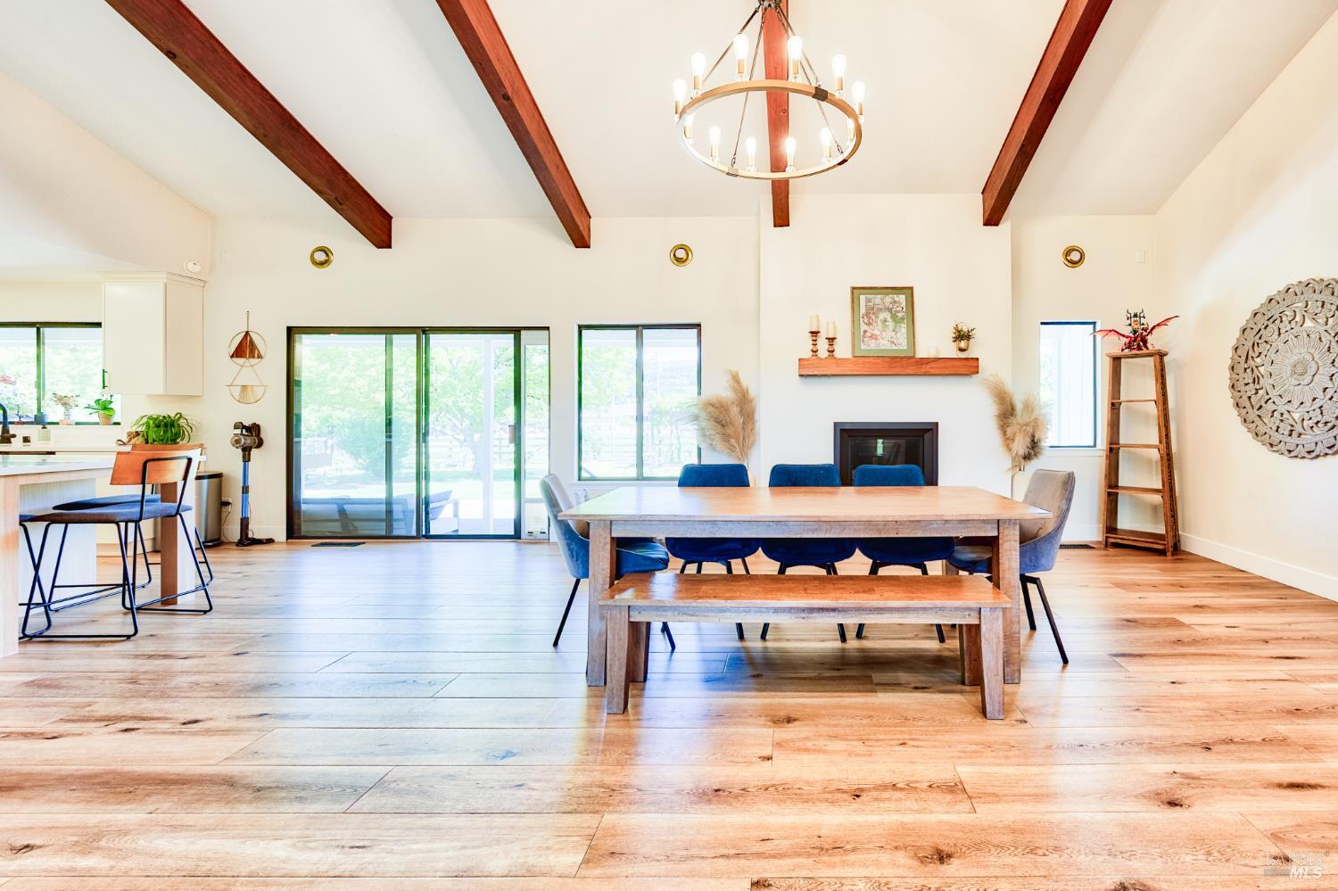 6282 Melita Road Santa Rosa, CA 95409 - Photo 11 of 55 a dining room with furniture a fireplace and wooden floor