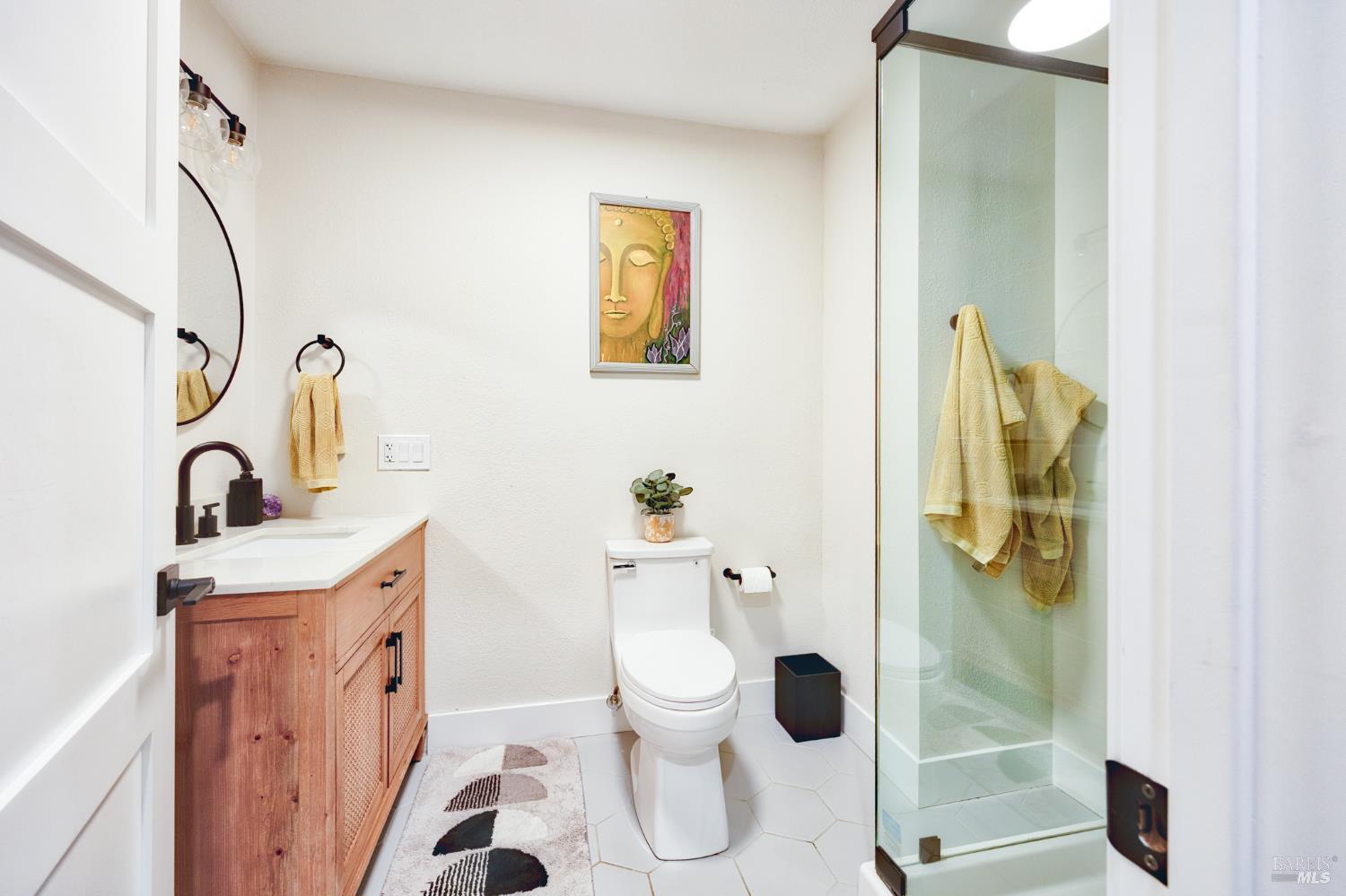 6282 Melita Road Santa Rosa, CA 95409 - Photo 20 of 55 a bathroom with a sink a toilet and shower