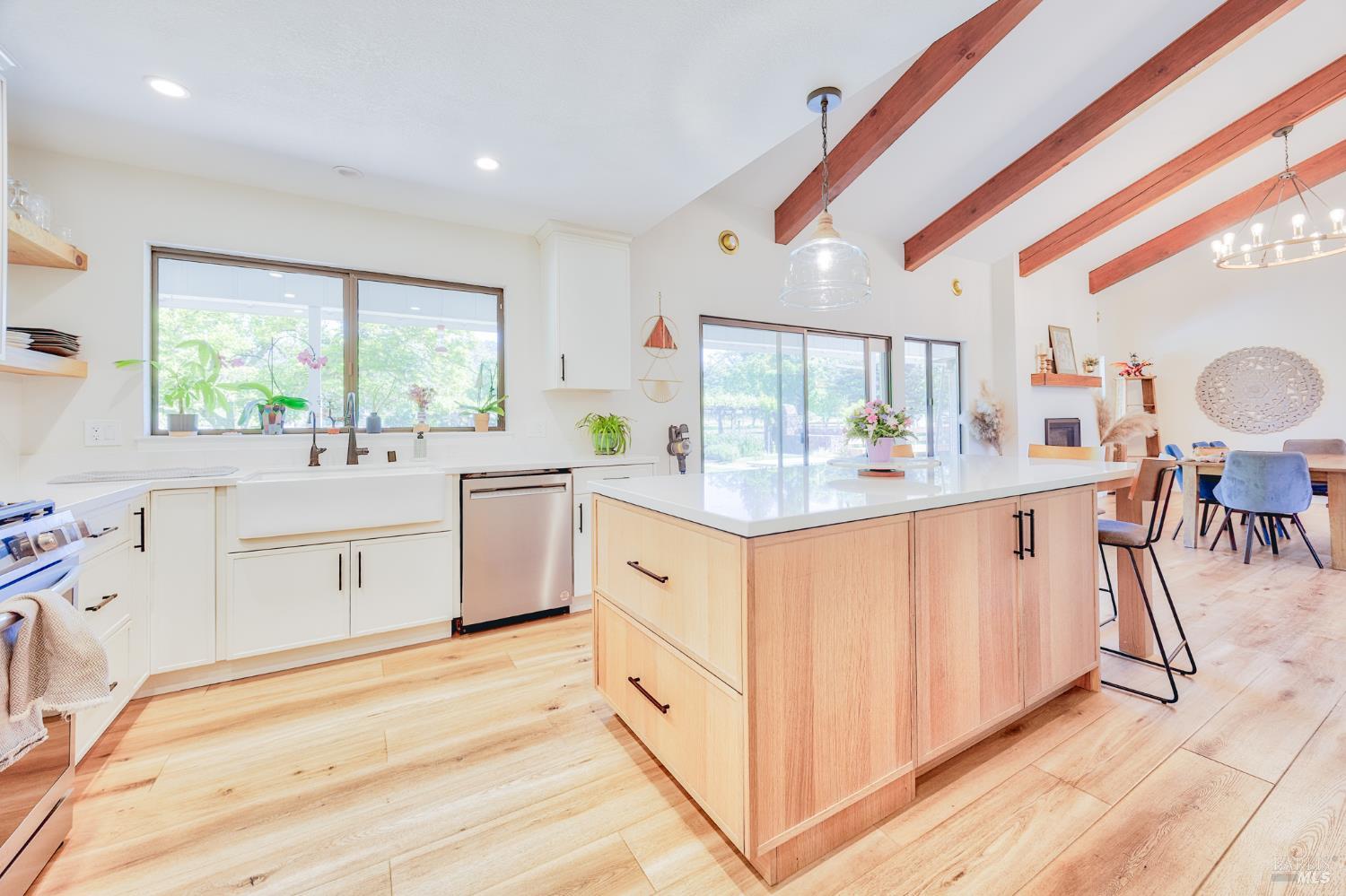 6282 Melita Road Santa Rosa, CA 95409 - Photo 2 of 55 a kitchen with stainless steel appliances white cabinets a sink and a large window