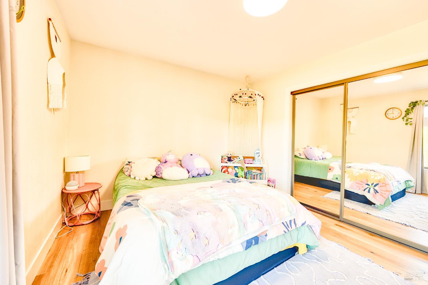 6282 Melita Road Santa Rosa, CA 95409 - Photo 22 of 55 a bedroom with a bed and a large window