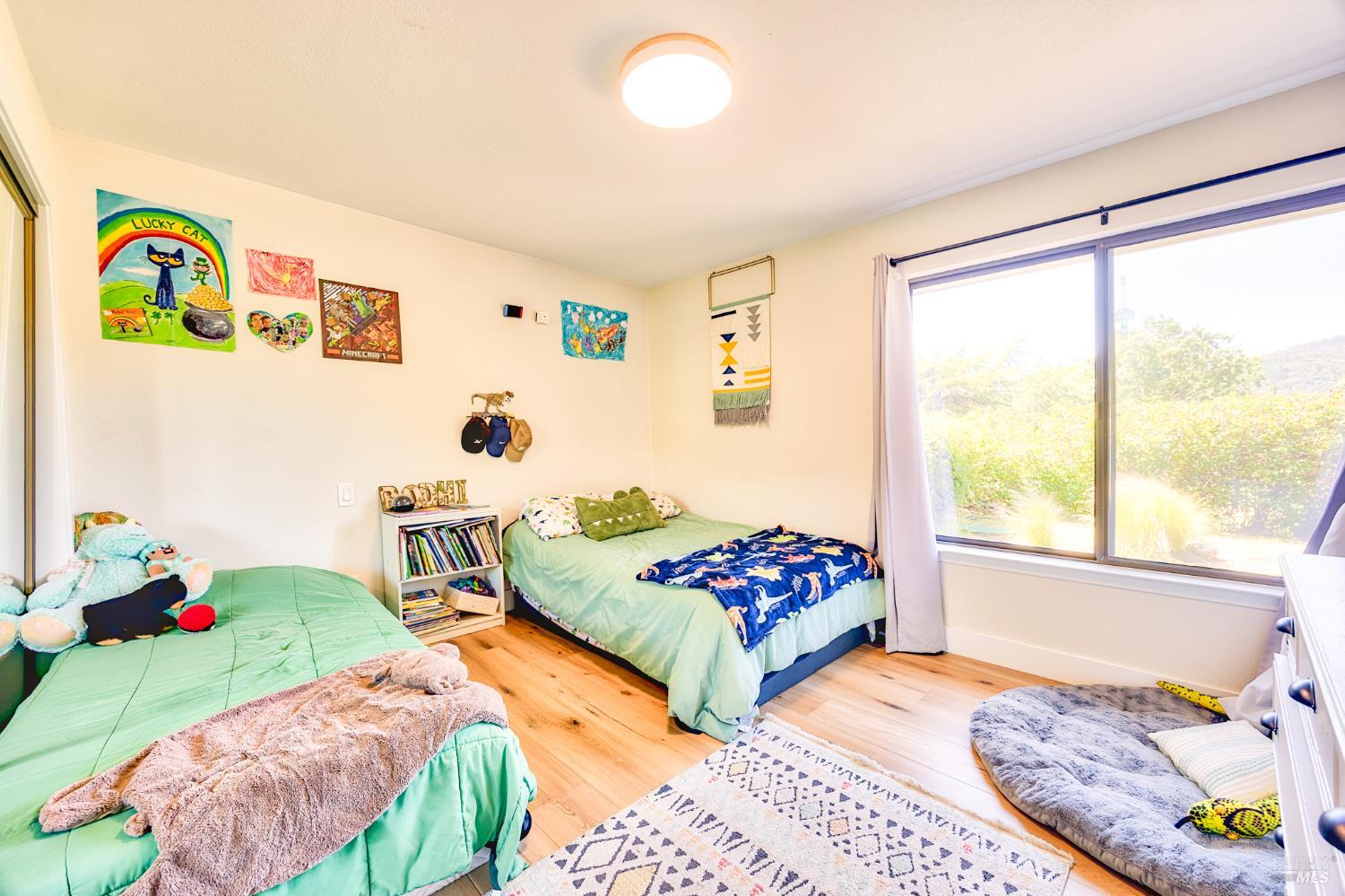 6282 Melita Road Santa Rosa, CA 95409 - Photo 25 of 55 a bedroom with two beds and a window