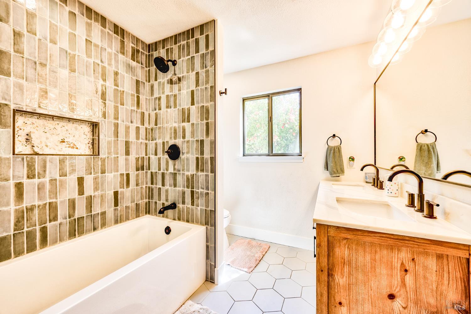 6282 Melita Road Santa Rosa, CA 95409 - Photo 27 of 55 a bathroom with a sink a bathtub and a shower