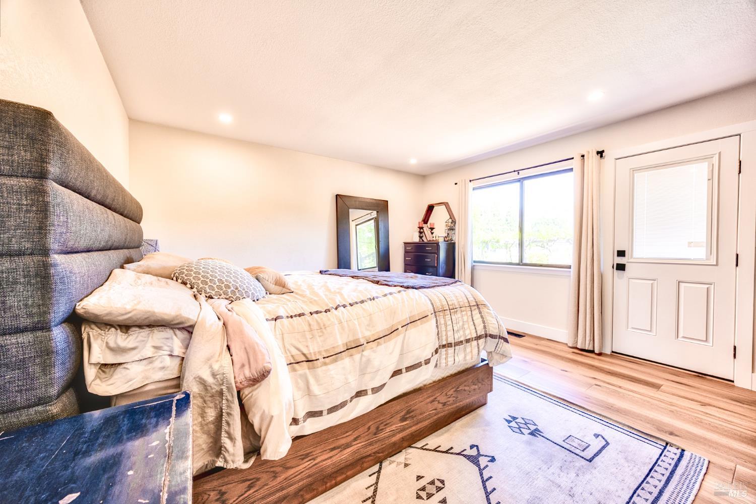 6282 Melita Road Santa Rosa, CA 95409 - Photo 28 of 55 a bed sitting in a bedroom next to a window
