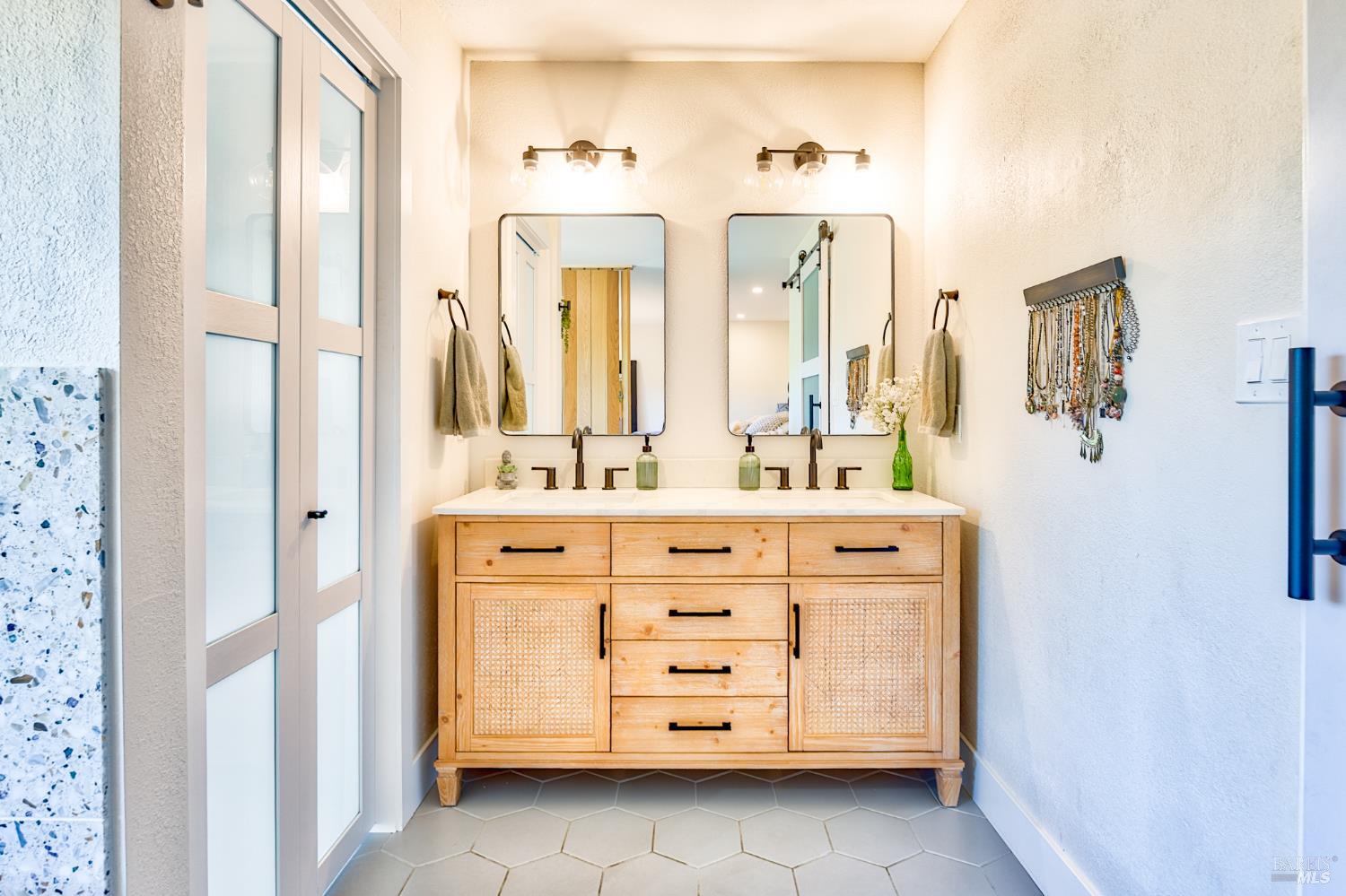 6282 Melita Road Santa Rosa, CA 95409 - Photo 31 of 55 a bathroom with a double vanity sink mirror and